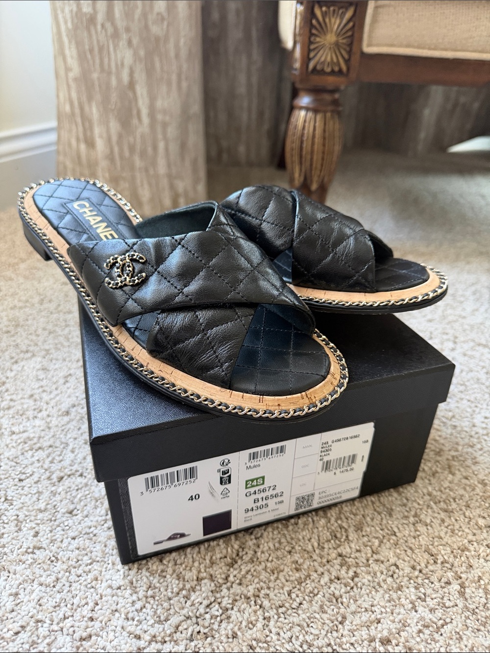 CHANEL Black Quilted Leather Crisscross Slide Mules with Chain Accent